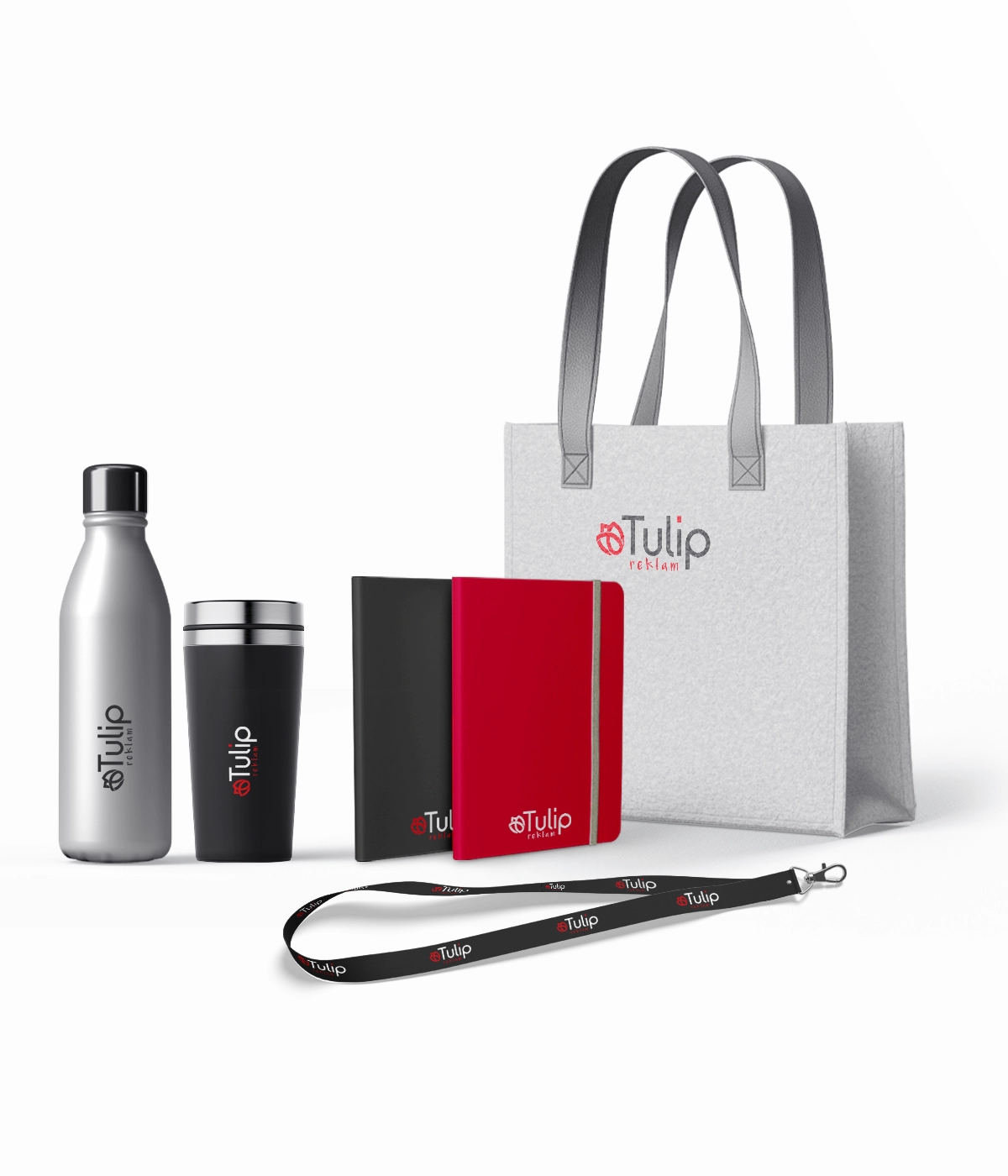 A branded corporate gift set featuring a tote bag, water bottle, travel mug, notebooks, and a lanyard, all printed with the red and black Tulip logo.