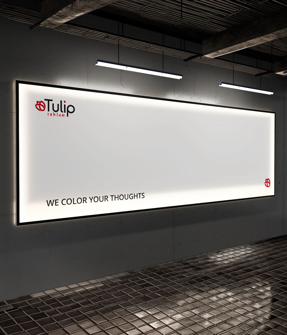 Large illuminated indoor advertising billboard with corporate branding on a gray concrete wall.